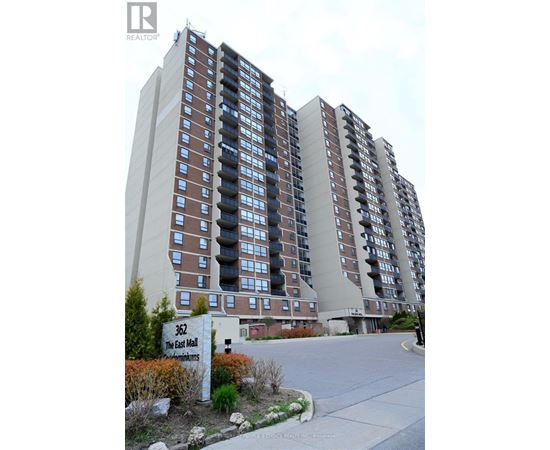 A tall residential building with a sign that reads "362 The East Wall".