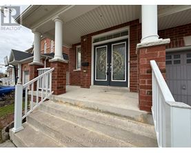 A house with a front porch and a staircase leading to it.
