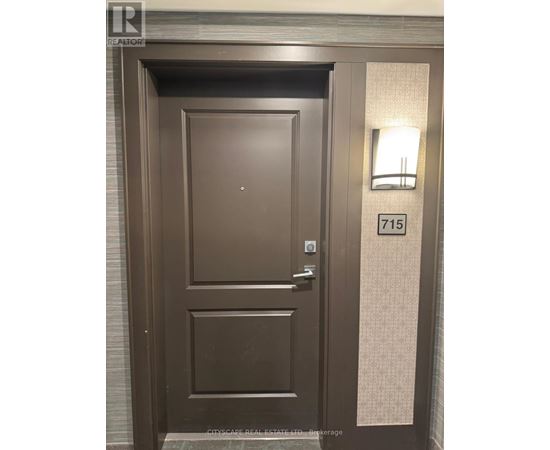 A brown door with a glass window and a handle.