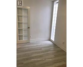 A room with a door and a window.