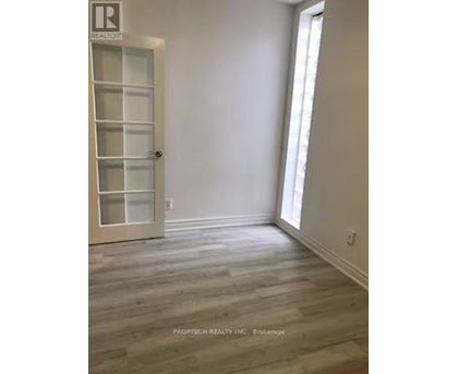 A room with a door and a window.