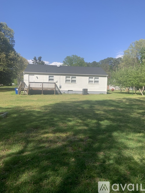 A house with a lawn in front of it.