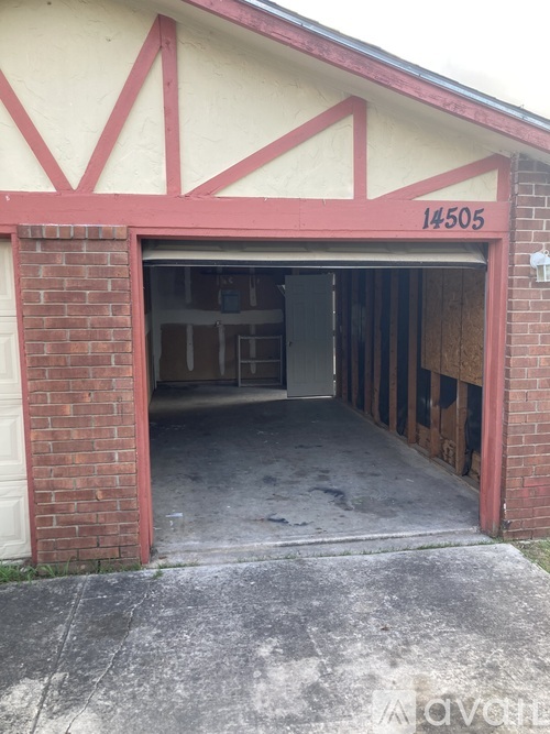 A garage with the number 14505 on the wall.