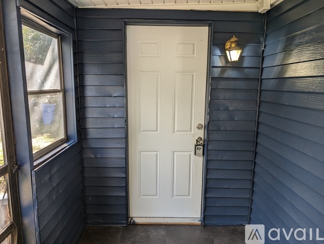 A white door is closed and has a doorknob on it.