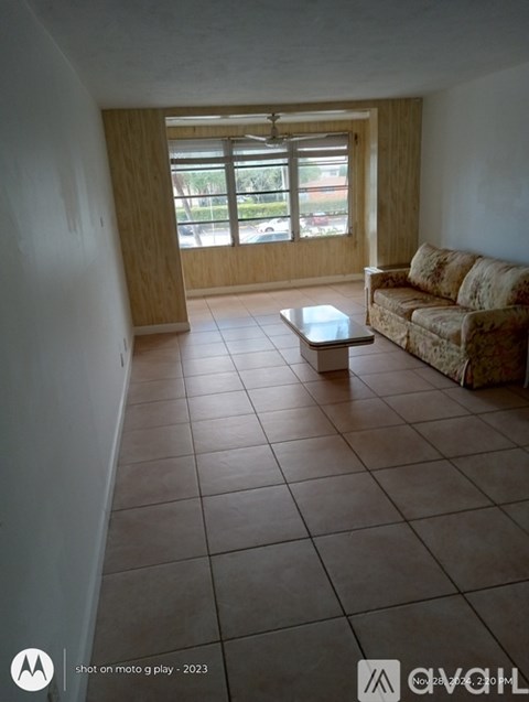 A living room with a couch and a coffee table.