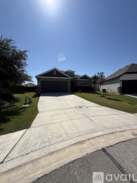 A house with a driveway in front of it.
