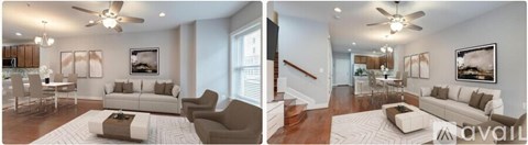 A living room with a white couch and a ceiling fan.