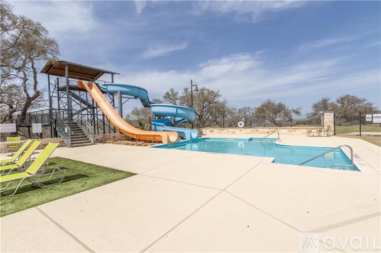 A playground with a slide and a pool.