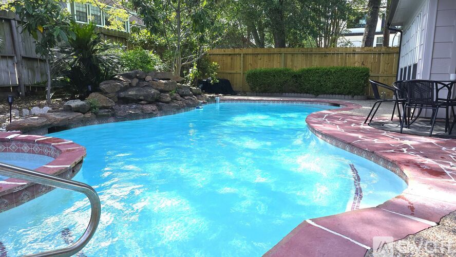 A small pool with a red tile border.