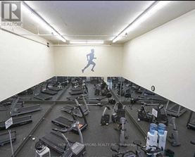 A gym with treadmills and exercise equipment.