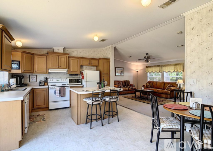 A kitchen with a white refrigerator and a white oven.
