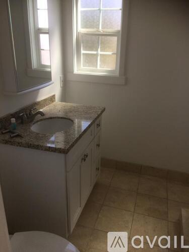 A small bathroom with a sink and a toilet.
