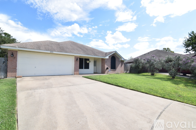 A house with a driveway in front of it.