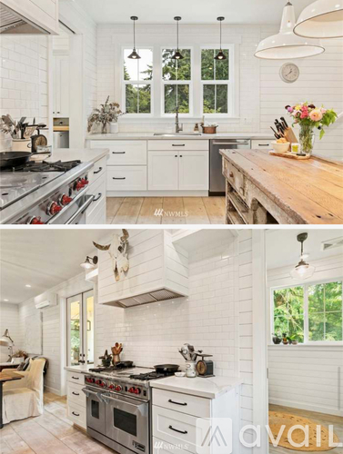 A modern kitchen with white cabinets and a wooden island.