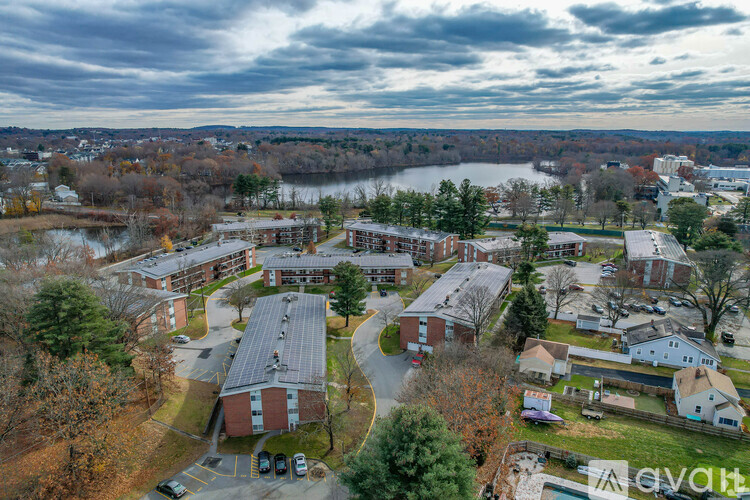 A bird's eye view of a residential area with a large building in the center.