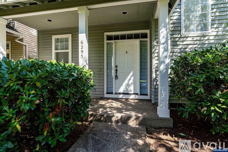 A house numbered 6295 is shown with a white door and a small porch.