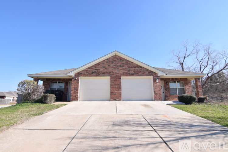 A house with a garage is for sale.