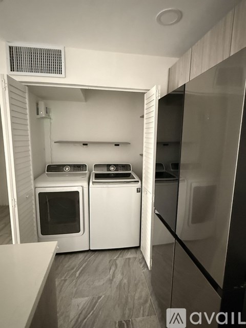 A small kitchen with a white oven and microwave.