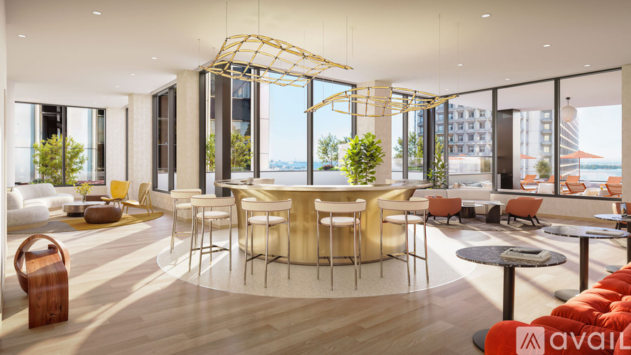 A modern living room with a large table and chairs.