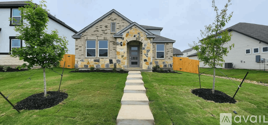 A stone house with a walkway in front of it.