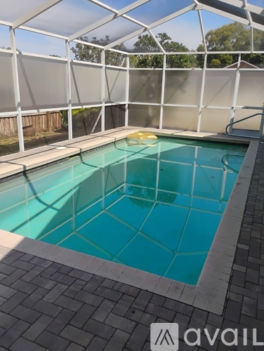 A small pool inside a glass enclosure.