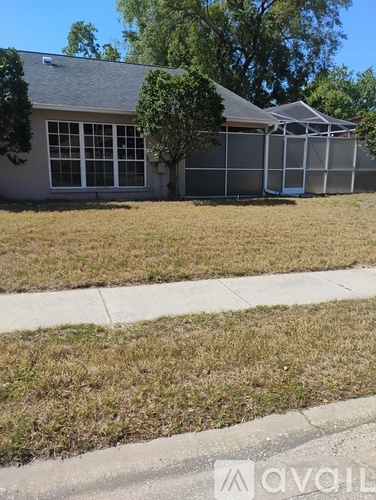 A house with a lawn in front of it.