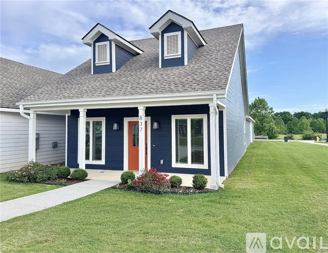 A house with a blue door and windows.