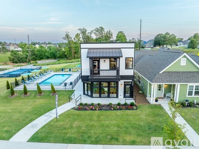A modern house with a pool in the backyard.