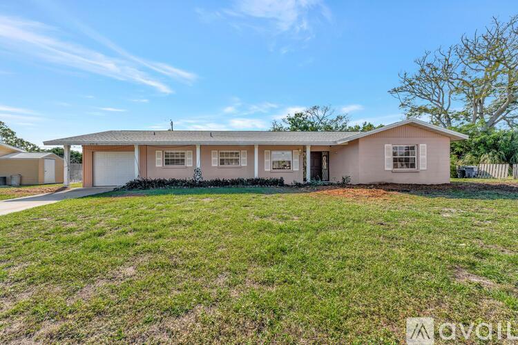 A house with a lawn in front of it is for sale.