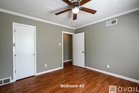 Bedroom 3 has a ceiling fan and hardwood floors.