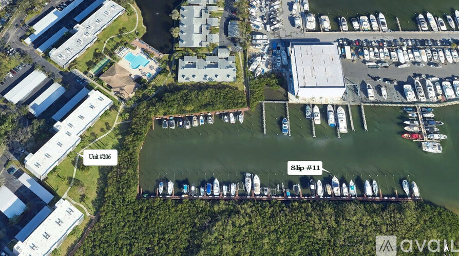 A marina with boats docked and a swimming pool.
