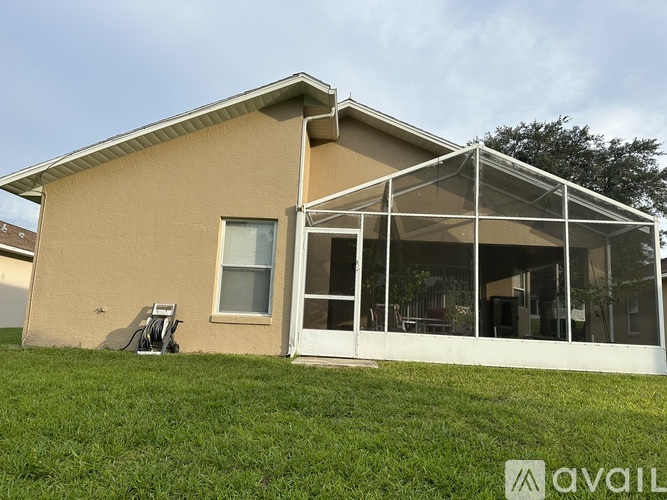 A house with a patio and a lawn chair.