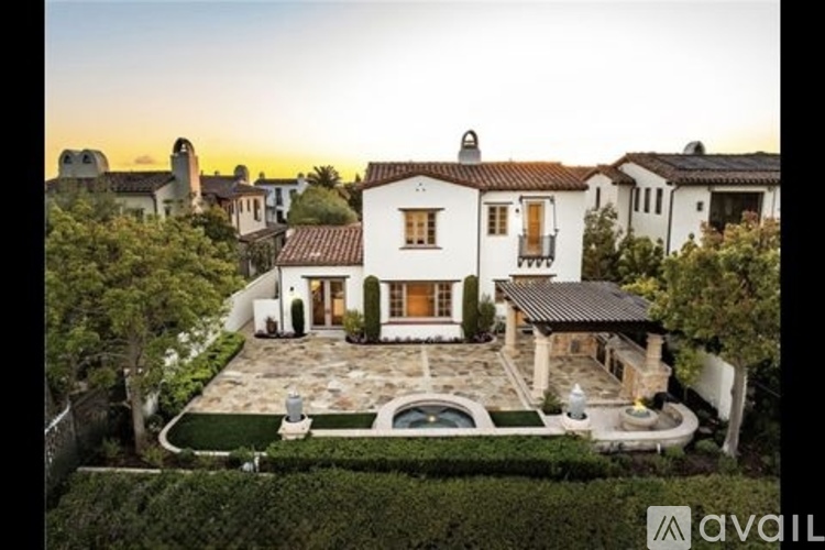A large, luxurious house with a swimming pool is for sale.