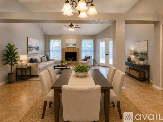 A living room with a fireplace and a large mirror above it.