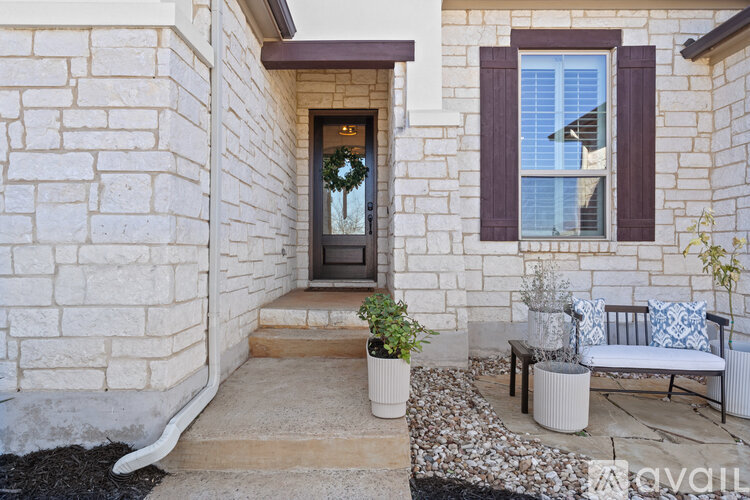 A house entrance with a door and a window.