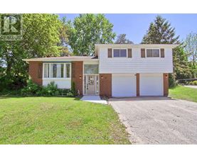 A two-story house with a garage on the side.