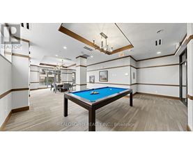 A billiard table in a room with a pool table.
