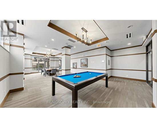 A billiard table in a room with a pool table.