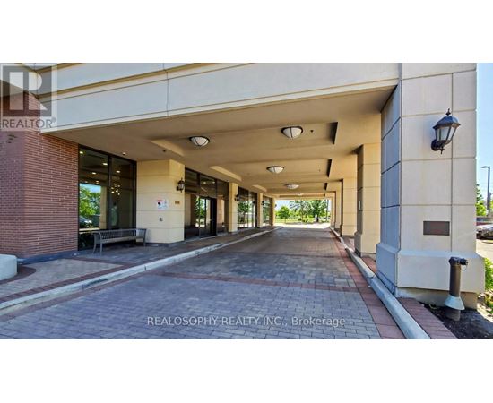 A long hallway with a Realosophy Realty Inc. sign at the end.