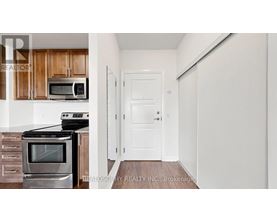 A kitchen with a stove top oven and microwave above it.