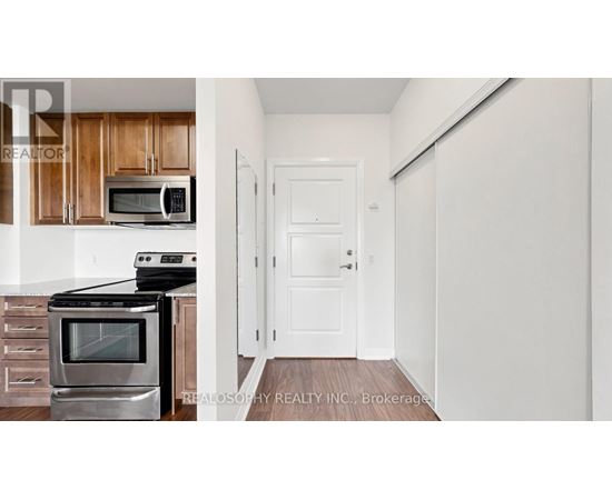 A kitchen with a stove top oven and microwave above it.
