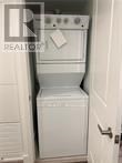 A white oven and dishwasher in a small kitchen.