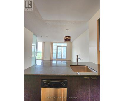 A kitchen with a sink and a dishwasher.