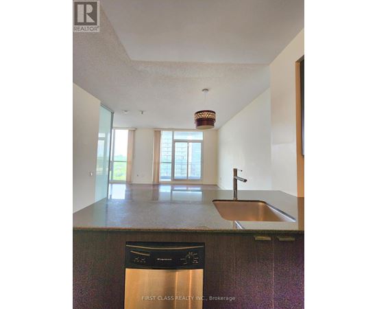 A kitchen with a sink and a dishwasher.