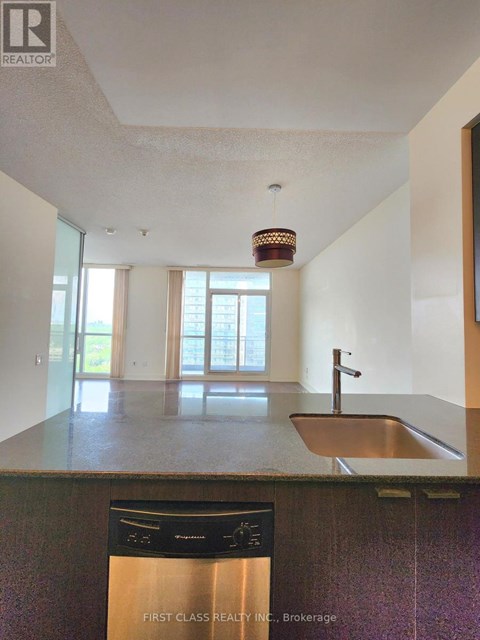 A kitchen with a sink and a dishwasher.