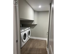 A laundry room with a washer and dryer.