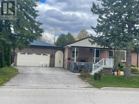 A house with a sign that says REALTOR in front of it.