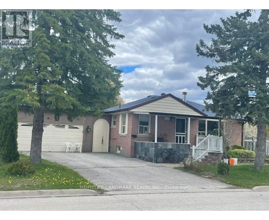 A house with a driveway and a bicycle parked on the side.