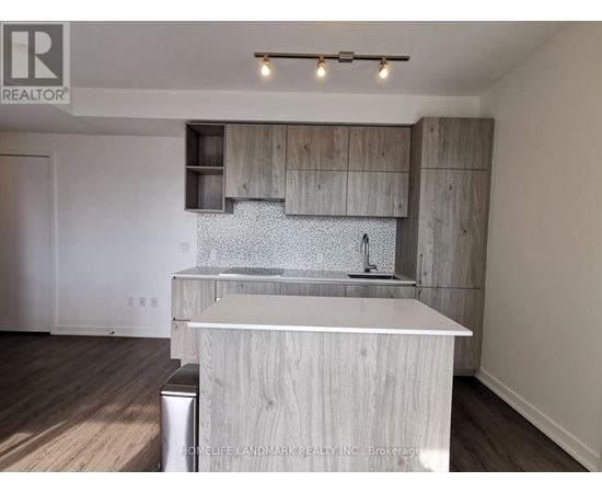 A modern kitchen with wooden cabinets and a white island.
