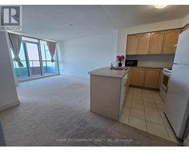 A kitchen with a refrigerator, microwave, and oven.